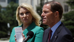 Sen. Richard Blumenthal, D-Conn. (right) and Elizabeth Wydra, congressional Democrats' attorney in a case accusing President Trump of violating the Constitution's Foreign Emoluments Clause, speak to reporters in June.
