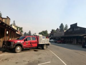A fire truck parks in downtown Winthrop, Washington. The Methow Valley sees signs of fire nearly every summer, including vehicles filled with firefighters rattling down the highway or parked in town. CREDIT: COURTNEY FLATT