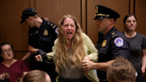 Protesters disrupt the confirmation hearing for Supreme Court nominee Judge Brett Kavanaugh before the Senate Judiciary Committee in on Capitol Hill Tuesday in Washington, D.C.
