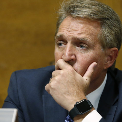 Sen. Jeff Flake, R-Ariz., listens as Christine Blasey Ford testifies before the Senate Judiciary Committee on Thursday.