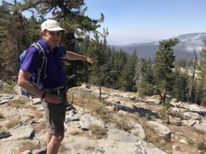 Fire ecologist Malcolm North looks down at the still-burning Lions Fire from a ridge in the Sierra Nevadas. CREDIT: NATHAN ROTT