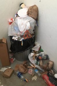 Trash overflows at the trailhead. CREDIT: TED ALVAREZ