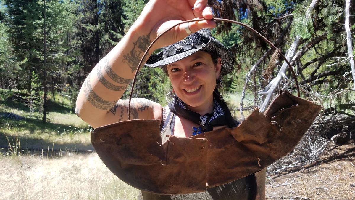 Southern Oregon University archaeologist Chelsea Rose with remnants of a five-part gold pan found during a dig this summer. CREDIT SOUTHERN OREGON UNIV. LABORATORY OF ANTHROPOLOGY