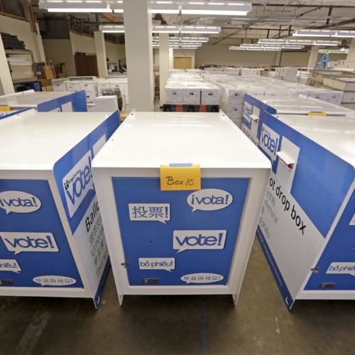 Ballot drop boxes are stored for future use in a warehouse area of the King County Elections office in Renton, Wash. While Washington is one of just three states that conduct all of their elections by mail, it's the only one of those three that allows ballots to be postmarked by election day. CREDIT: ELAINE THOMPSON