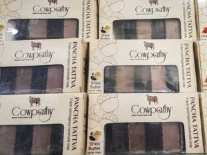 Boxes of soap from Cowpathy Care. Cow dung is dried and turned into a powder, then added to the bars. CREDIT: SUSHMITA PATHAK