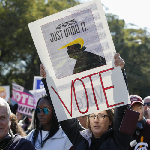 Women gather for a rally and march at Grant Park on Saturday in Chicago to urge voter turnout ahead of the midterm elections. CREDIT: KAMIL KRZACZYNSKI