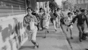 Leftist demonstrators flee after Salvadoran National Guard troops fire into a crowd of protesters on the steps of the San Salvador Cathedral on May 9, 1979. CREDIT: Tony Comiti/Sygma via Getty Images