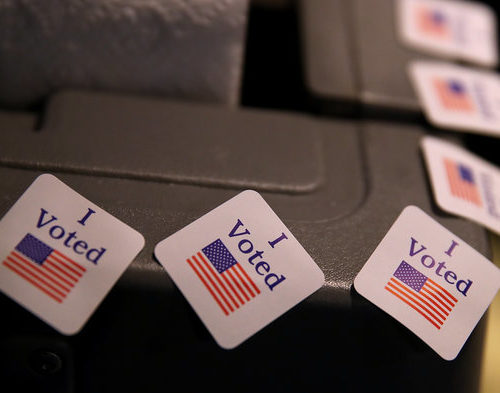 Election officials across the country have worked hard to prioritize security ahead of November's midterms, but some strategies could have the unintended effect of sometimes making voting harder. CREDIT: JUSTIN SULLIVAN