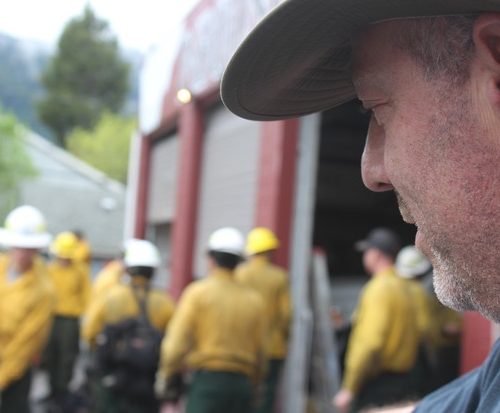 Dillon Sanders looks on as a collection of wildland firefighters train for an upcoming season. Sanders is the owner of Inbound LLC in Oakridge, Oregon, which runs 20-person hand crews and 13 engines for fire suppression. CREDIT: TONY SCHICK
