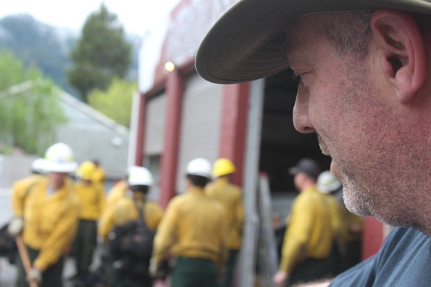 Dillon Sanders looks on as a collection of wildland firefighters train for an upcoming season. Sanders is the owner of Inbound LLC in Oakridge, Oregon, which runs 20-person hand crews and 13 engines for fire suppression. CREDIT: TONY SCHICK