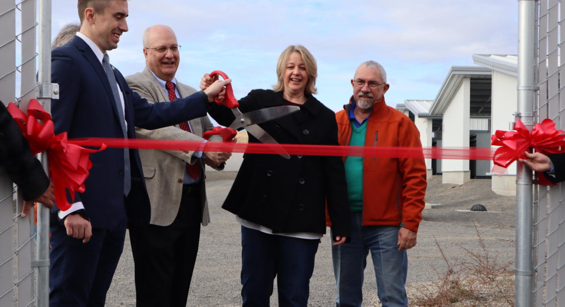 Dignitaries cut the ribbon at the grand opening of Bitmain's new East Wenatchee bitcoin mine -- in other words, a data center that earns cryptocurrency. CREDIT: TOM BANSE