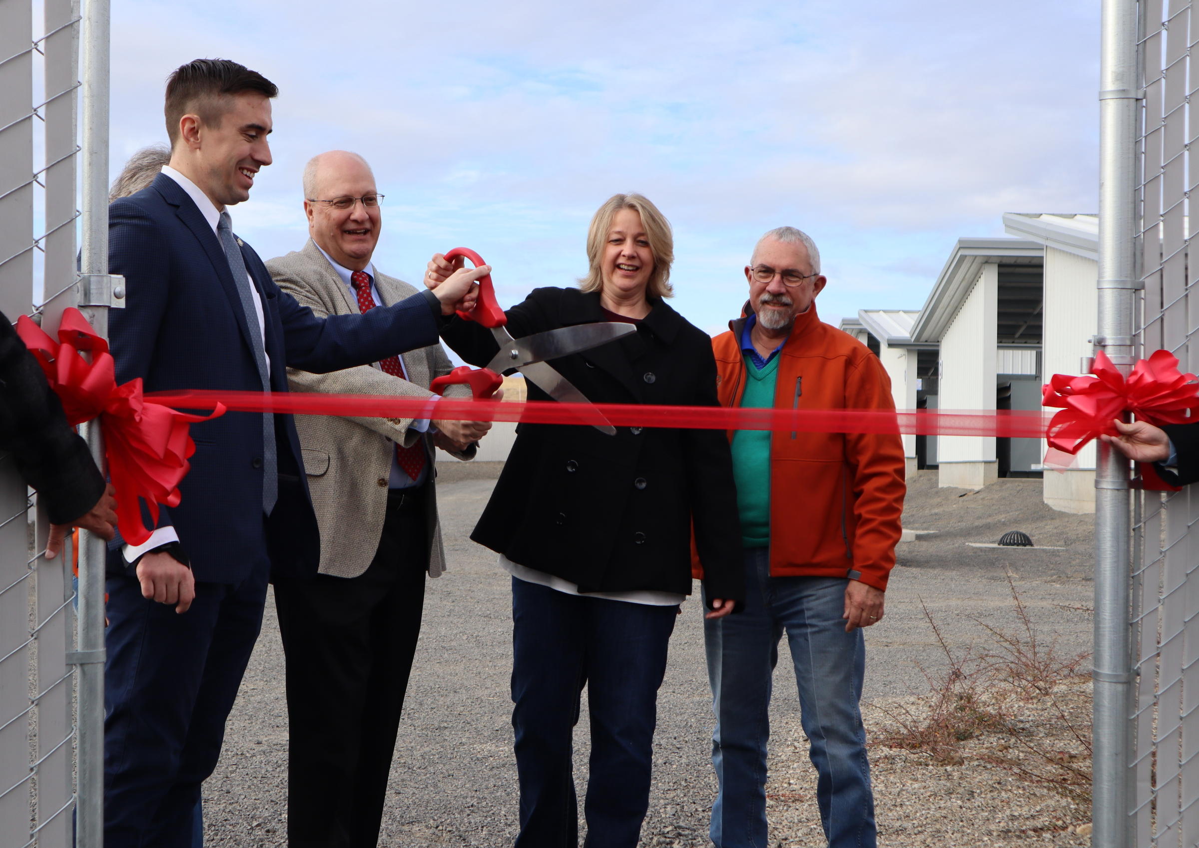 Dignitaries cut the ribbon at the grand opening of Bitmain's new East Wenatchee bitcoin mine -- in other words, a data center that earns cryptocurrency. CREDIT: TOM BANSE