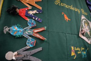 Inside New Hope Clinic, quilts like this one adorn the hallways. Often they’re made by the families of HIV and AIDS patients. This one was used as coffin cover for Bobby Joe, a patient who died in 1997. CREDIT: ESMY JIMENEZ/NWPB