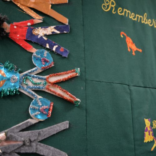 Inside New Hope Clinic, quilts like this one adorn the hallways. Often they’re made by the families of HIV and AIDS patients. This one was used as coffin cover for Bobby Joe, a patient who died in 1997. CREDIT: ESMY JIMENEZ/NWPB