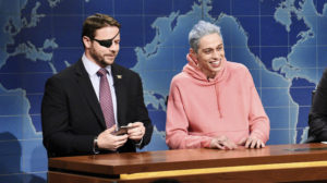 In this Nov. 10, 2018 photo provided by NBC, Lt. Com. Dan Crenshaw, left, a congressman-elect from Texas, appears next to comedian Pete Davidson during Saturday Night Live's "Weekend Update" in New York. CREDIT: Will Heath/NBC via AP