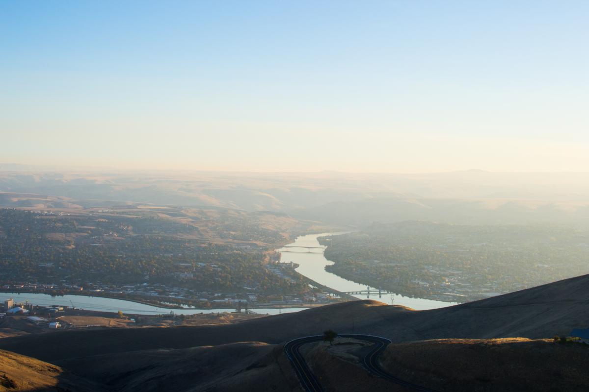 The Snake River splits Lewiston, Idaho, left, from Clarkston, Washington, right. Marilena Delgado moved 45 miles from Orofino, Idaho to Clarkston to enroll in Medicaid to treat a rare health condition called SMAS. CREDIT: JAMES DAWSON / BSPR