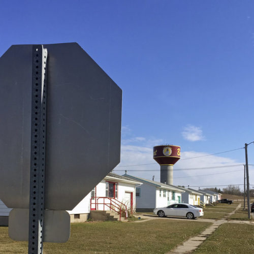 Residential roads with no street name or number signs, such as this one in Belcourt, N.D., are common on the Turtle Mountain Indian Reservation. Under recently tightened state rules, voters in North Dakota are required to present identification with a street address, which is a hurdle for Native Americans. CREDIT: Blake Nicholson/AP