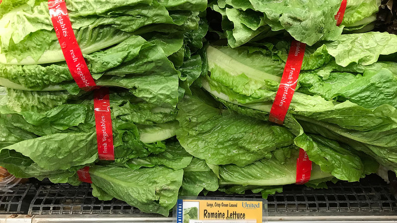 Romaine lettuce is displayed on a shelf at a supermarket in California in April, during an E. coli outbreak traced to contaminated lettuce. The CDC says a new outbreak has made lettuce dangerous to eat, just in time for America's most foodcentric holiday. Justin Sullivan/Getty Images