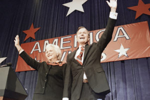 Bush and his wife, Barbara, wave at a victory party after he beat Democrat Michael Dukakis in the 1988 presidential election.