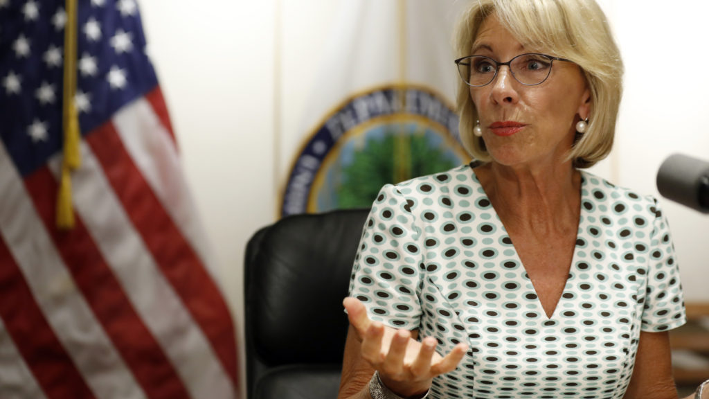 Education Secretary Betsy DeVos speaks with the media after a series of listening sessions about campus sexual violence in July 2017. Among the significant changes is that schools can make it harder to prove allegations. Alex Brandon/AP