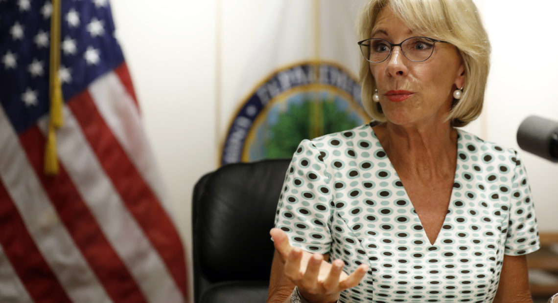 Education Secretary Betsy DeVos speaks with the media after a series of listening sessions about campus sexual violence in July 2017. Among the significant changes is that schools can make it harder to prove allegations. Alex Brandon/AP