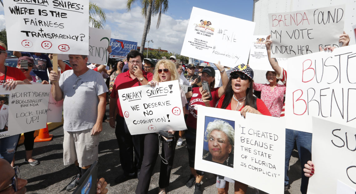 Crowds gathered outside of the Broward County Supervisor of Elections this week in Florida. The elections for governor and U.S. Senate are heading for recounts. CREDIT: Joe Skipper/AP