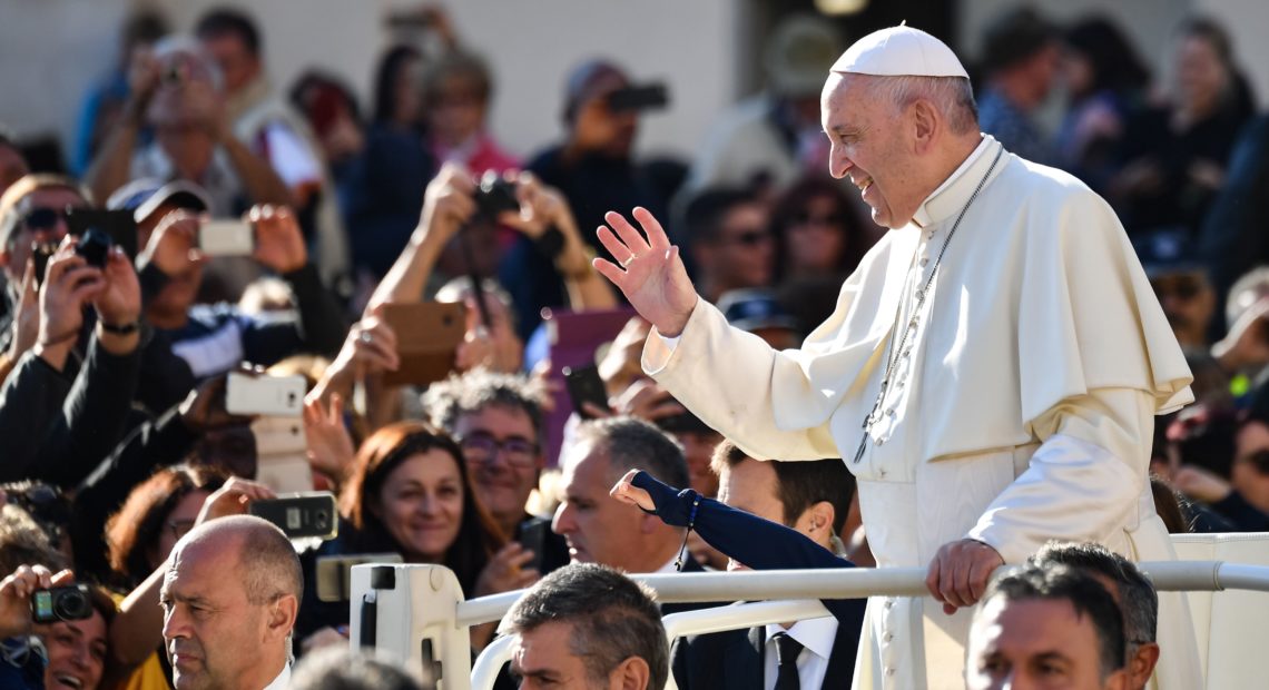 Pope Francis greets the crowd in the Vatican's St. Peter's Square in October. Many of the pope's most vocal opponents are in the United States, attacking him in tweets, blogs and politically conservative media. CREDIT: ALBERTO PIZZOLI