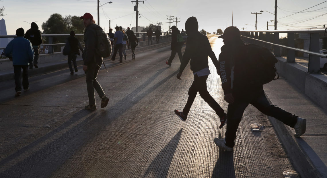 Members of the migrant caravan walk to make requests for political asylum at the U.S.-Mexico border last week in Tijuana, Mexico.
