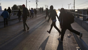 Members of the migrant caravan walk to make requests for political asylum at the U.S.-Mexico border last week in Tijuana, Mexico.
