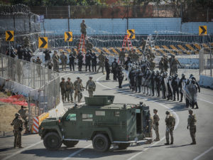 U.S. military and border agents secure the United States-Mexico border at the San Ysidro border crossing south of San Diego, Calif. on Nov. 25. CREDIT: Sandy Huffaker/AFP/Getty Images