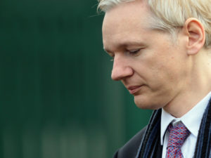 WikiLeaks founder Julian Assange could soon be facing criminal charges from the Department of Justice, according to language discovered in an unrelated court document by terrorism researcher Seamus Hughes.