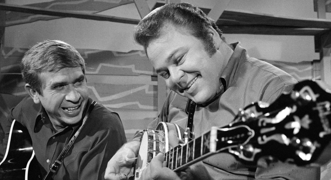 Hee Haw co-hosts Roy Clark (right) and Buck Owens in 1969. Clark died Thursday at the age of 85.