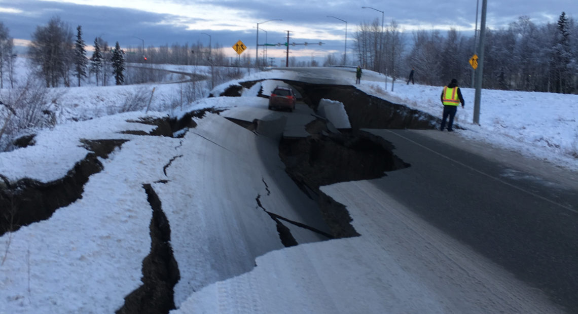 After an earthquake on Friday, a car is trapped in a crumbled section of off-ramp from Minnesota Drive, a major road in Anchorage, Alaska. CREDIT: Nathaniel Herz/Alaska Public Media