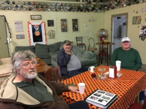 Dennis Hall (from left), Bob Bement and Steve Paulsen get together most mornings at the Lucky Cup in Vale, Ore. They drink coffee, crack jokes and largely steer clear of talk about politics and the media. But they're quick to praise the Malheur Enterprise, the local weekly paper headquartered in Vale. CREDIT: TOM GOLDMAN/NPR