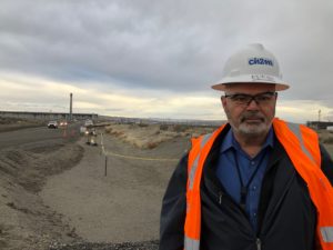 Mark Wright, vice president with CH2M HILL Plateau Remediation Company, a Hanford contractor, stands in front of Hanford’s Tunnel 2 where workers are grouting it closed. CREDIT: ANNA KING