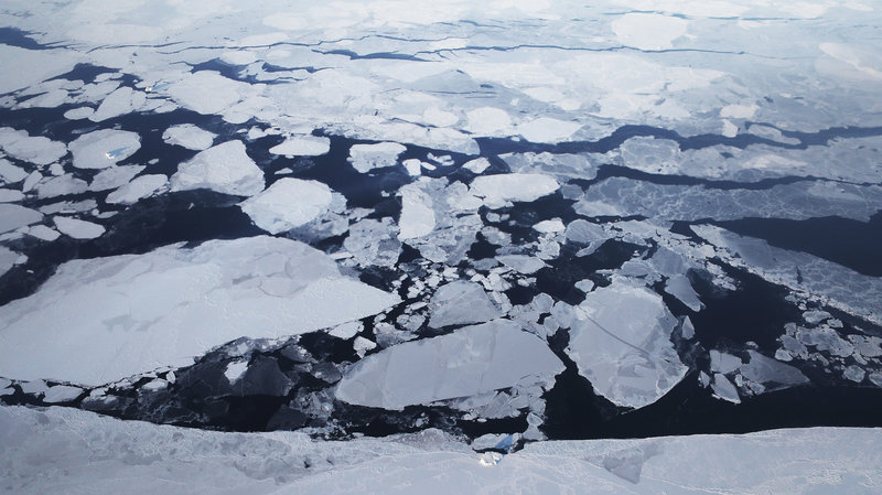 Sea ice is seen from NASA's Operation IceBridge research aircraft off the northwest coast of Greenland in March 2017. A new report says rapid warming over the past three decades has led to a 95 percent decline of the Arctic's oldest and thickest ice. CREDIT: Mario Tama/Getty Images
