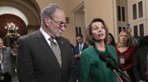 House Speaker-designate Nancy Pelosi, D-Calif., and Senate Minority Leader Chuck Schumer, D-N.Y., address reporters about the fight over funding a border wall before the partial government shutdown. Pelosi will lead House Democrats in voting on a bill to reopen the government when they take power in the House on Thursday. CREDIT: J. Scott Applewhite/AP