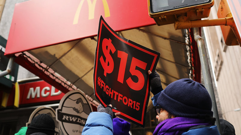 Protesters with NYC Fight for $15 gather in front of a McDonalds to rally against fast food executive Andrew Puzder, who was President Trump's nominee to lead the Labor Department on February 13, 2017 in New York City. CREDIT: Spencer Platt/Getty Images