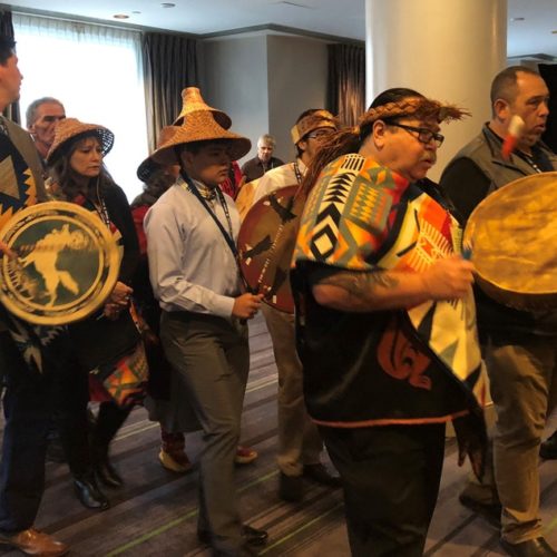 Representatives of Washington tribes perform a "paddle song" at the start of a hearing in Victoria, B.C., on the Trans Mountain Pipeline. CREDIT: NATIONAL ENERGY BOARD