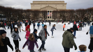 People get in what could be their last skate for a while at the National Gallery of Art Sculpture Garden Ice Rink this week. The museum and the skate rink will be closed to the public after Jan. 2 if the shutdown continues into the new year. CREDIT: Jacquelyn Martin/AP