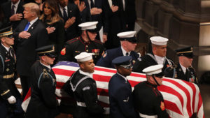 A military honor guard carries the casket of former President George H.W. Bush during the funeral at the National Cathedral in Washington, D.C. CREDIT: CHERYL DIAZ MEYER/NPR