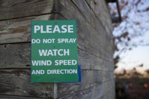 A sign is shown attached to a building on the Perez property on Monday, November 19, 2018, in Quincy. KUOW Photo/Megan Farmer CREDIT: KUOW PHOTO/MEGAN FARMER