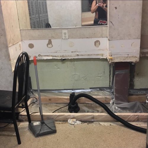 The locker room at Little Darlings, a club owned by Deja Vu. Both of the dancers who spoke at the hearing worked here and at other Deja Vu clubs. The locker room regularly has standing water from flooding, which sometimes spills onto the dance floor. CREDIT: WORKING WA