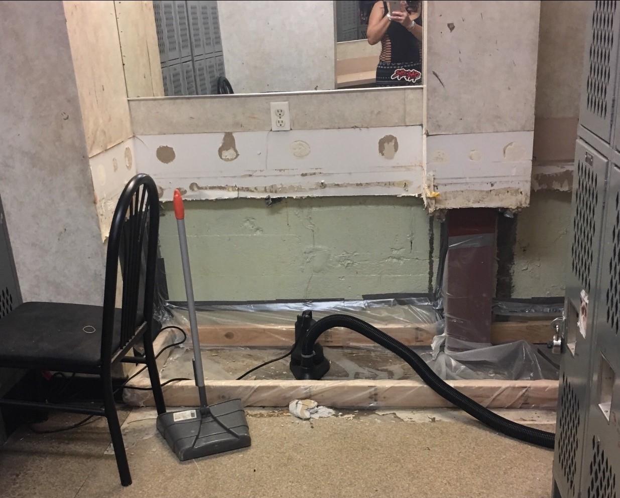 The locker room at Little Darlings, a club owned by Deja Vu. Both of the dancers who spoke at the hearing worked here and at other Deja Vu clubs. The locker room regularly has standing water from flooding, which sometimes spills onto the dance floor. CREDIT: WORKING WA