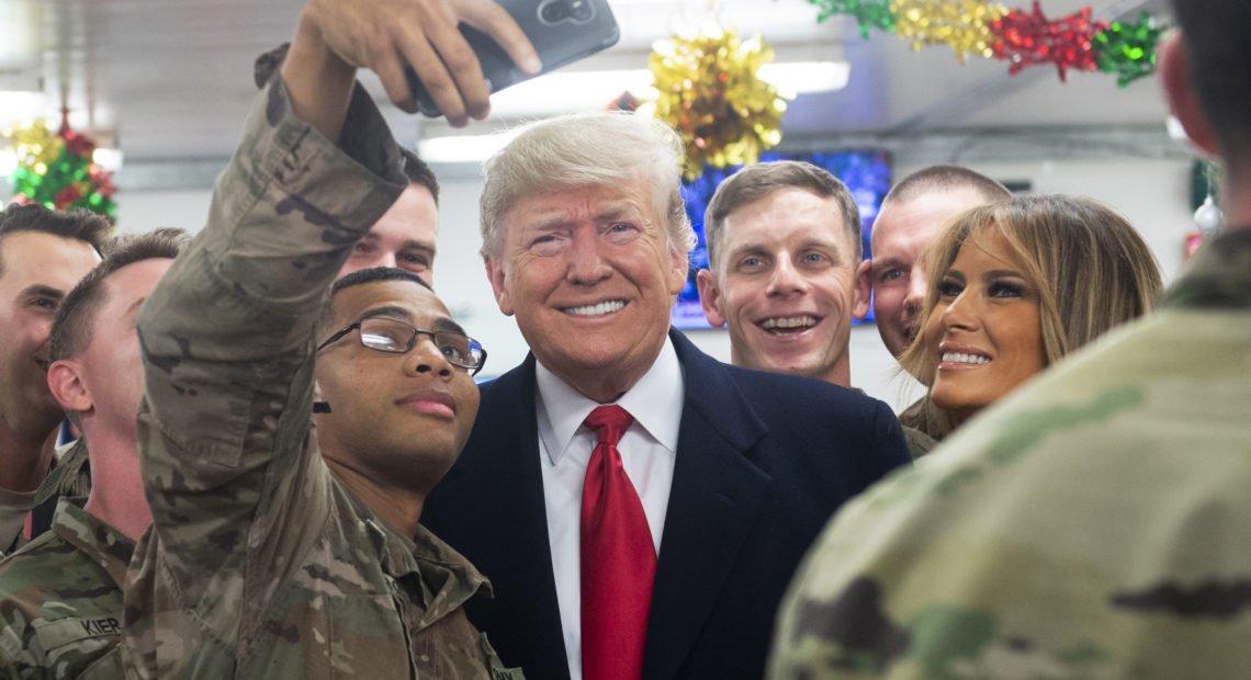 President Trump and first lady Melania Trump greet members of the U.S. military during an unannounced trip to al-Asad Air Base in Iraq on Wednesday. CREDIT: Saul Loeb/AFP/Getty Images