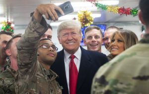 President Trump and first lady Melania Trump greet members of the U.S. military during an unannounced trip to al-Asad Air Base in Iraq on Wednesday. CREDIT: Saul Loeb/AFP/Getty Images