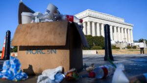 A box of trash overflows near the Lincoln Memorial in Washington, D.C., this week as some government services have been stopped during a partial government shutdown. CREDIT: Andrew Caballero-Reynolds/AFP/Getty Images