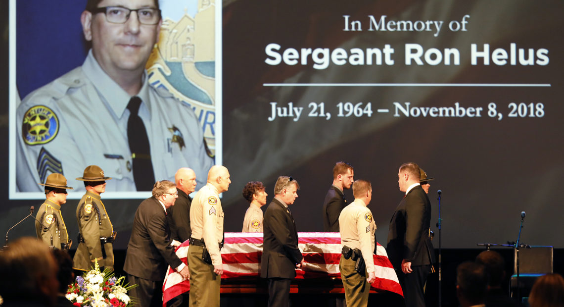 The casket of Ventura County Sheriff Sgt. Ron Helus arrives on stage for a memorial service on Nov. 15 in Westlake Village, Calif. CREDIT: Al Seib/Getty Images