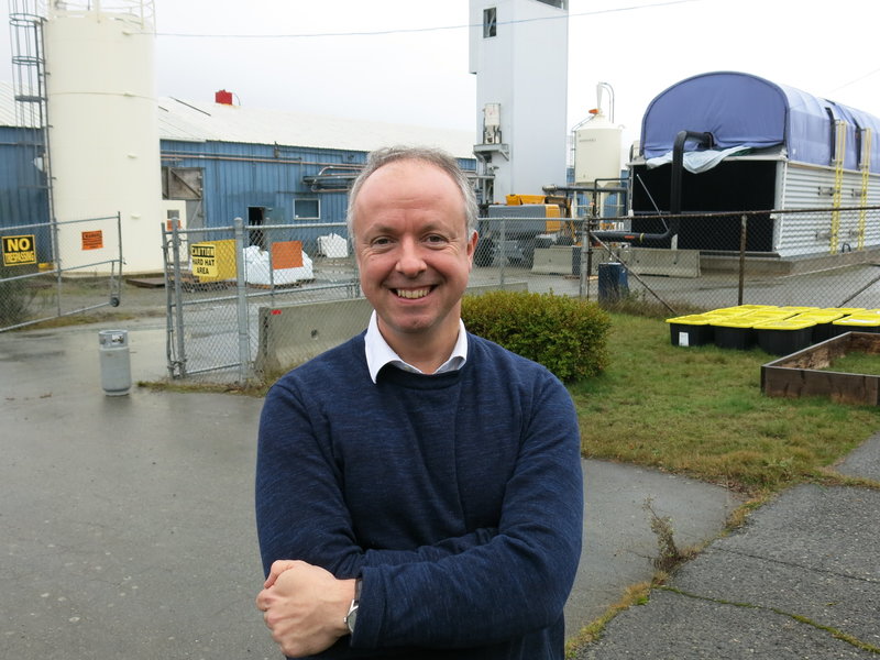 Carbon Engineering CEO Steve Oldham stands in front of the company's Squamish, British Columbia, pilot plant. It uses a chemical process to extract carbon dioxide from the air and turn it into a fuel similar to crude oil. CREDIT: JEFF BRADY/NPR