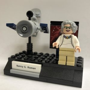 Lego honored Astronomer Nancy Grace Roman by including her figurine, shown next to the Hubble Space Telescope, in a set of groundbreaking NASA women. Russell Lewis/NPR